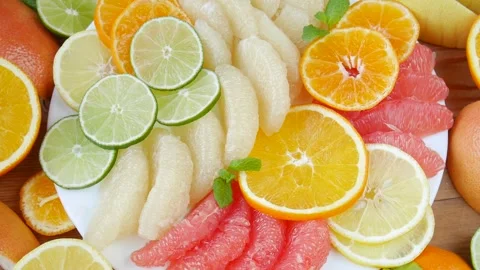 Sliced fruit on a plate. Stock Footage 243877723