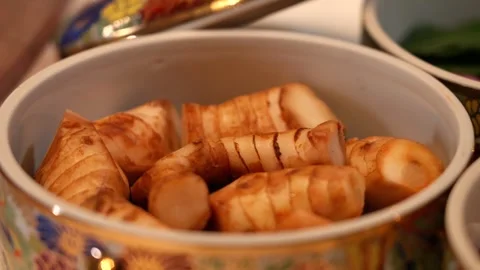 Sliced Galangal Root in Benjarong Ceramic Bowl Stock Footage 336706964