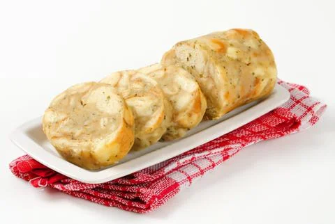 Sliced garlic bread on a white plate Stock Photos