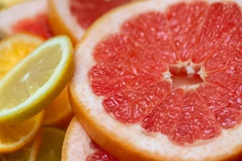 Sliced grapefruit close up. Fruit background. Stock Photos