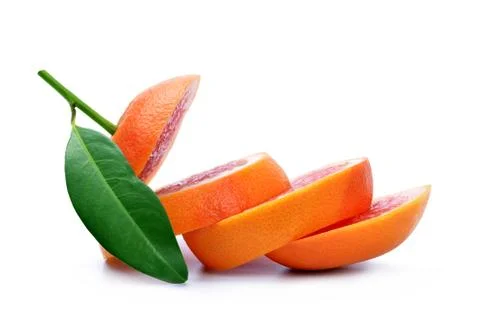Sliced grapefruit with green leaf Stock Photos