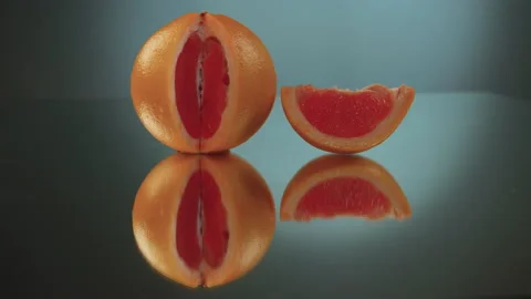 Sliced ​​grapefruit slices on a turntable. Close-up of grapefruit details. Stock Footage 171548296