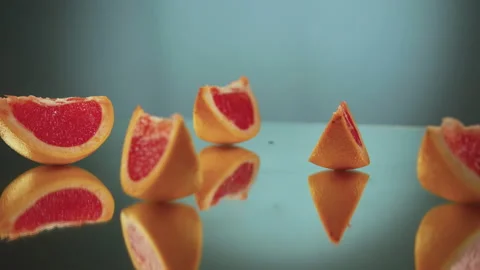 Sliced ​​grapefruit slices on a turntable. Close-up of grapefruit details. Stock Footage 171549040