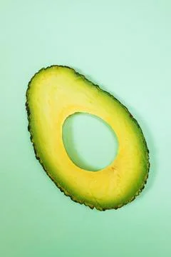 Sliced green avocado Stock Photos