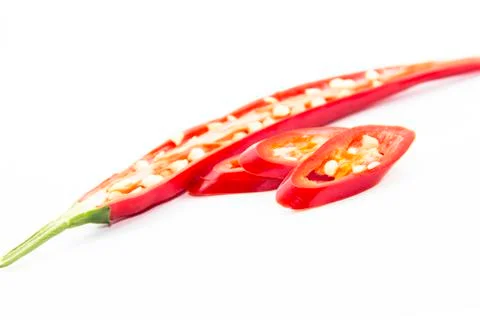 Sliced half and pieced of red chili pepper Stock Photos