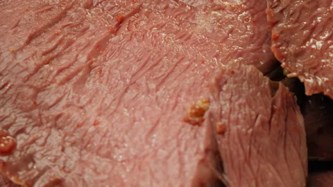 Sliced ham bacon meat, beef pastrami thick pieces on a wooden board, beef or Stock-Footage 243322375