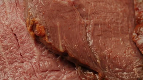 Sliced ham bacon meat, beef pastrami thick pieces on a wooden board, beef or 動画素材 244668071