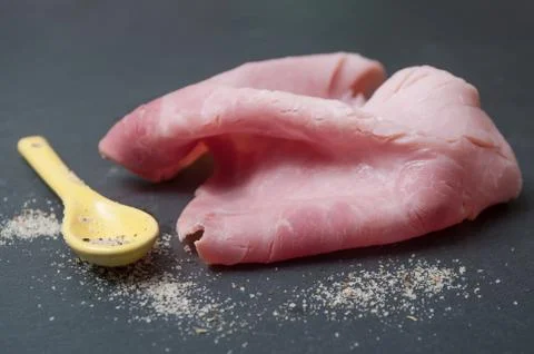 Sliced ham on chalkboard background Stock Photos