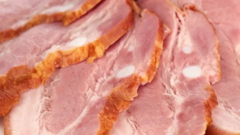 Sliced ham close up rotating Stock Footage 137752193