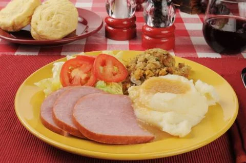 Sliced ham with mashed potatoes Stock Photos