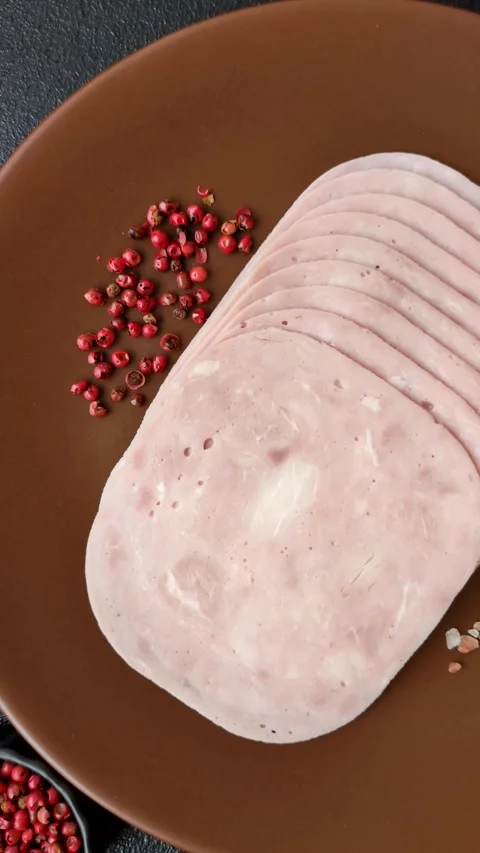 Sliced ham, meat or pork sausage for sandwiches. Cooked smoked prosciutto, ham Video stock 311335397