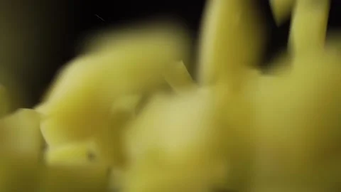 Sliced hard cheese cubes fall from top to bottom on wooden table scatter Stock Footage 143974846
