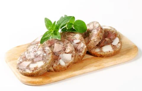 Sliced head cheese on a cutting board Stock Photos