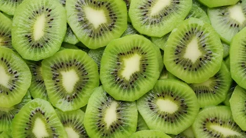 Sliced kiwi fruit top view, rotation. Fresh and healthy food concept 스톡 동영상 231036060