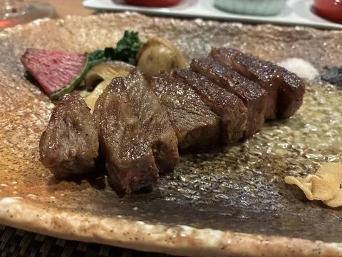 Sliced Kobe beef steak served on a ceramic plate in Kyoto, Japan Fotos Stock