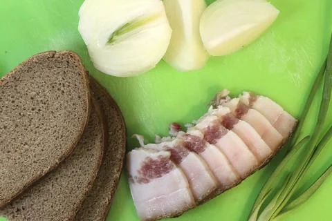 Sliced lard, onion, bread Stock Photos