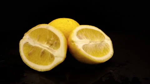Sliced Lemon On Black Background Stock Footage 131800423