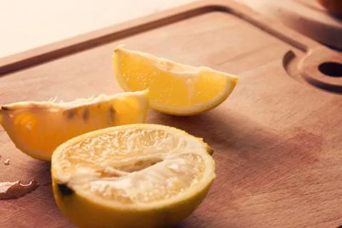 Sliced Lemon On The Board Stock Photos