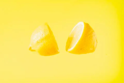 Sliced lemon floating Stock Photos