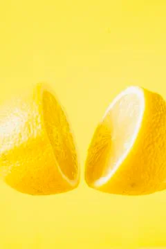 Sliced lemon floating Stock Photos