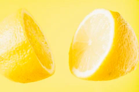 Sliced lemon floating Stock Photos