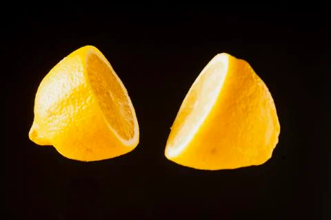 Sliced lemon floating Stock Photos