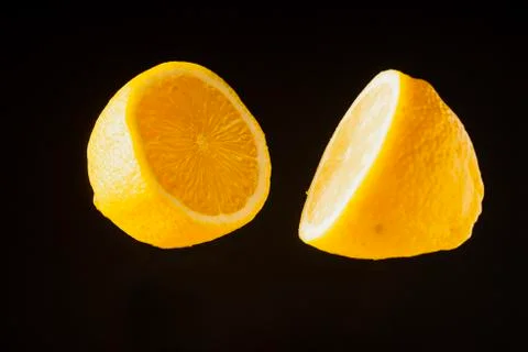 Sliced lemon floating Stock Photos