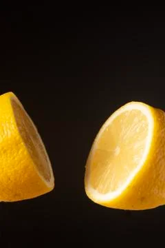 Sliced lemon floating Stock Photos