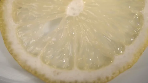 Sliced lemon on a plate close up Stock Footage 90401726