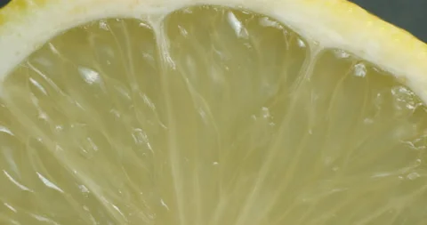 Sliced lemon rotating close up Stock Footage 141697292