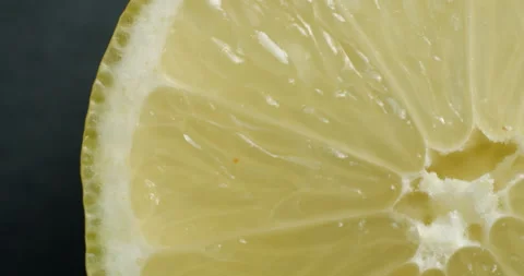 Sliced lemon rotating close up 스톡 동영상 141697419