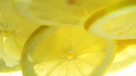 Sliced lemon rotating in the water Stock Footage 197473392