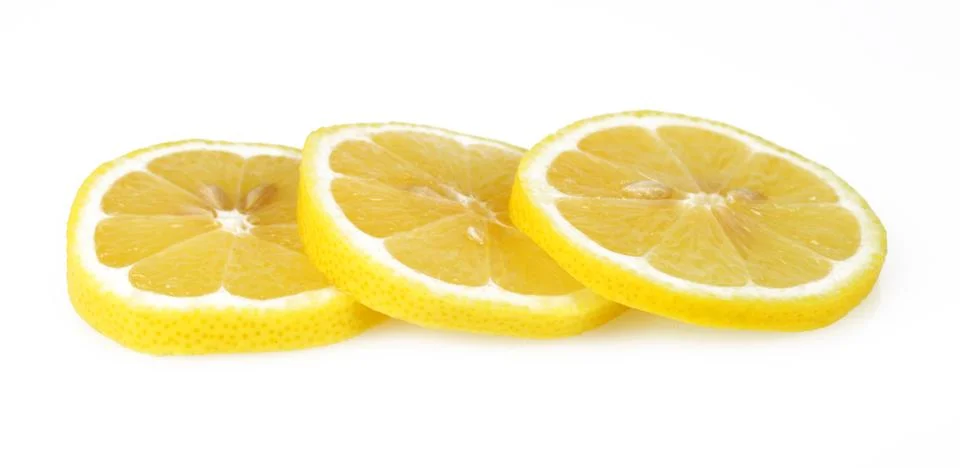 Sliced lemon round slices, white background, macro Stock Photos