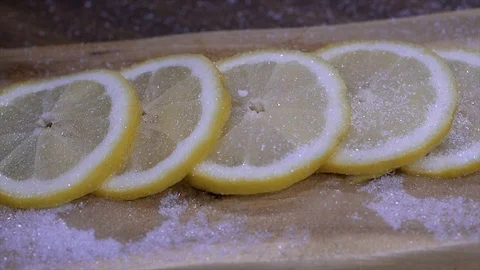 Sliced lemon sprinkled with sugar Stock-Footage 87998937