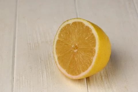 Sliced lemon on the table. Close up. White background Stock Photos