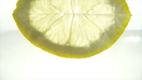 Sliced lemon in the water Slow motion Stock Footage 197473391