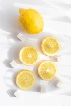 Sliced lemon on a white background . Lemon layout. Sliced fruit. Yellow color Stock Photos