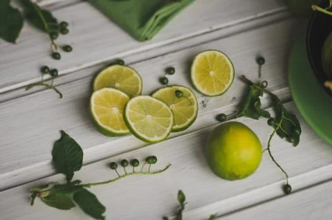 Sliced lemon on a white table 8694. Stock Photos