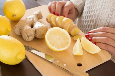 Sliced lemons and ginger root Stock Photos