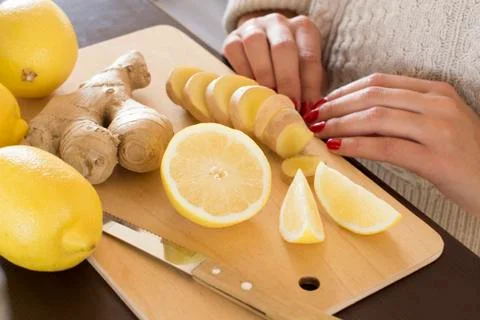 Sliced lemons and ginger root Stock Photos
