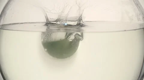 Sliced lemons falling into water. Stock Footage 54484204