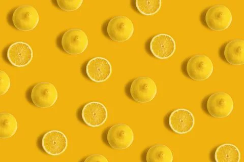 Sliced lemons on a yellow background Stock Photos