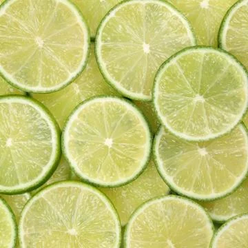Sliced lime fruits background Stock Photos