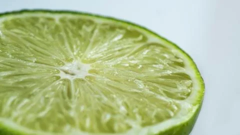 Sliced lime macro Stock Photos