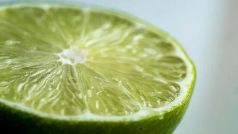 Sliced lime macro Stock Photos
