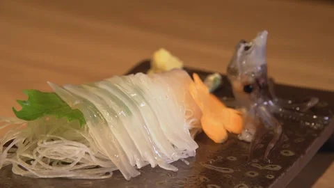 Sliced Live Squid Sashimi Plate Slow Camera Pan Stock Footage 342594828