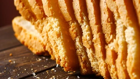 Sliced loaf of bread on black background Stock Footage 87215362