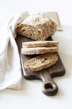 Sliced loaf of bread on a board Stock Photos
