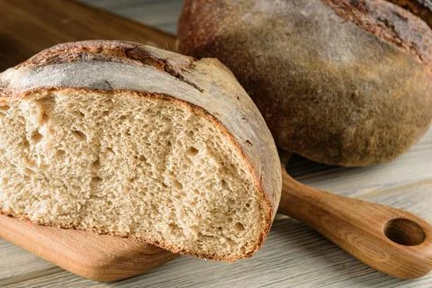 Sliced ??loaf of dark bread close-up. Stock Photos