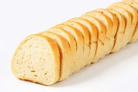 Sliced loaf of light bread on a table Stockfoto's